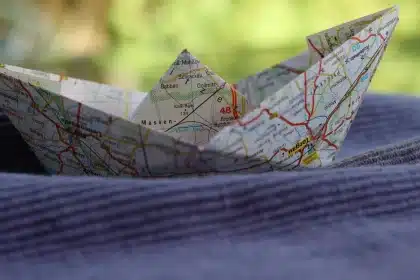 Map of West and Central Africa with pushpins and a stethoscope on a table
