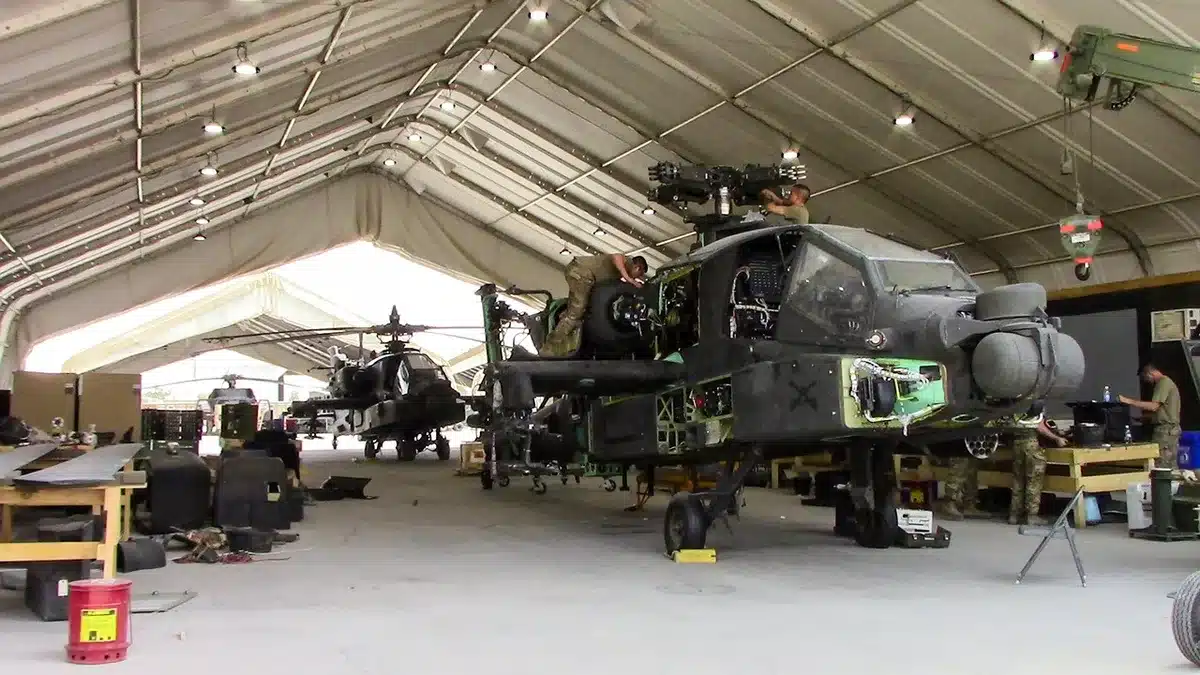Interior of an aircraft service facility with technicians at work