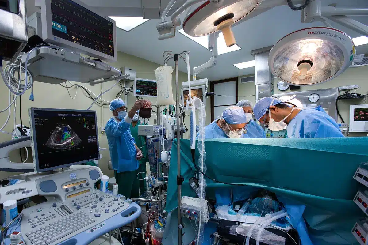 Gurney and medical-style equipment in a sterile room, shot anonymously