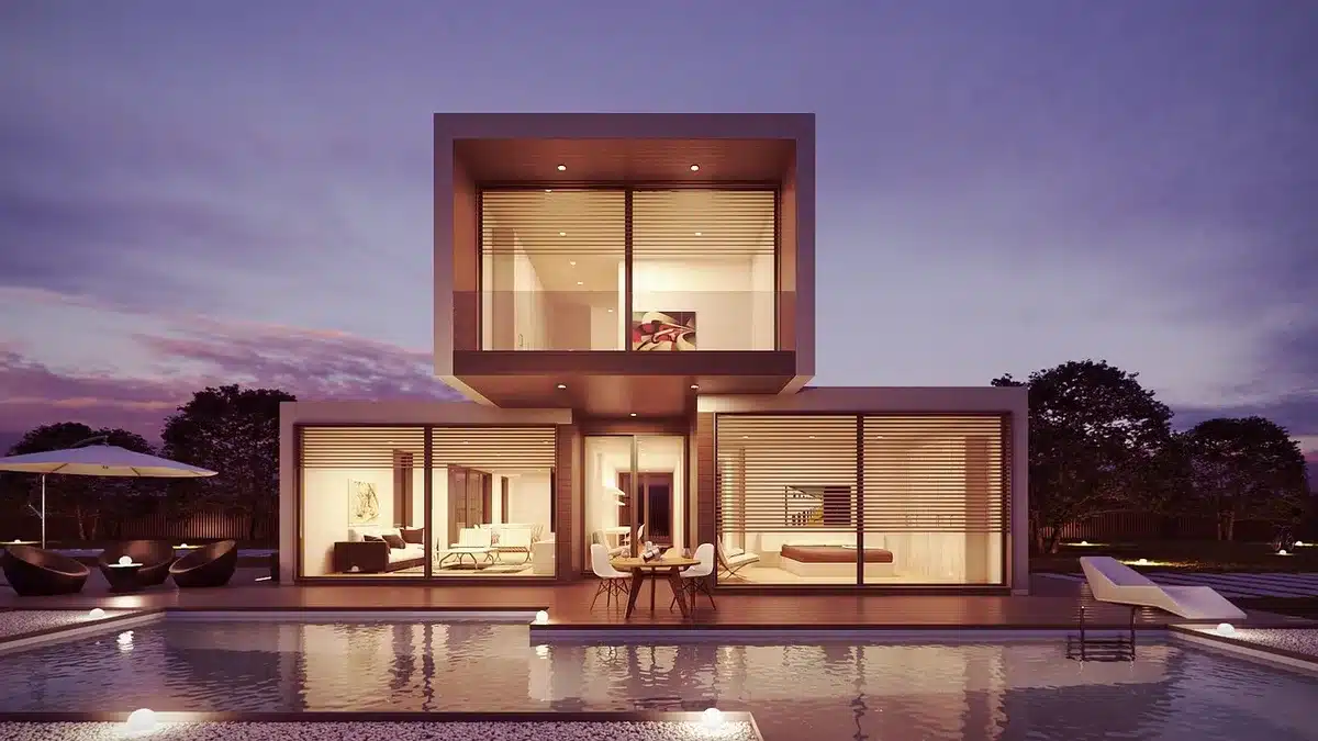 Renovated luxury home exterior with palm trees and modern facade
