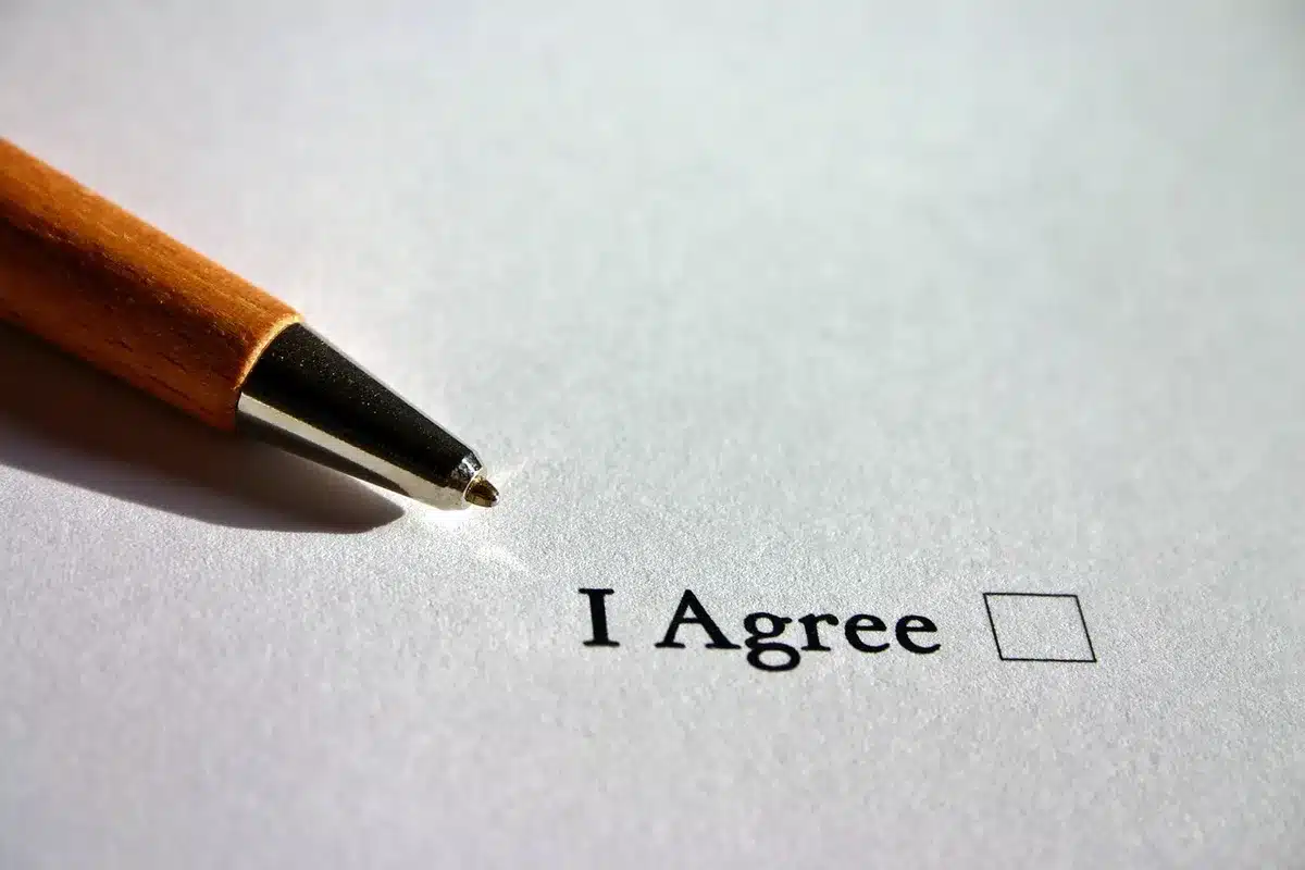 Person filling out an online claim form on a laptop