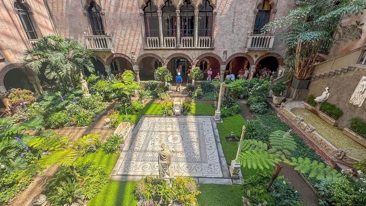 Modest Boston multifamily home with moving boxes on the stoop
