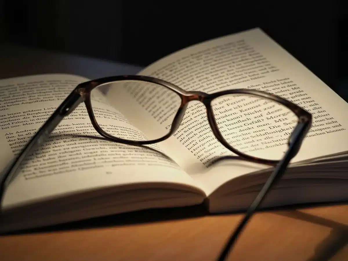 Host's desk with headset, books and notes, studio backdrop
