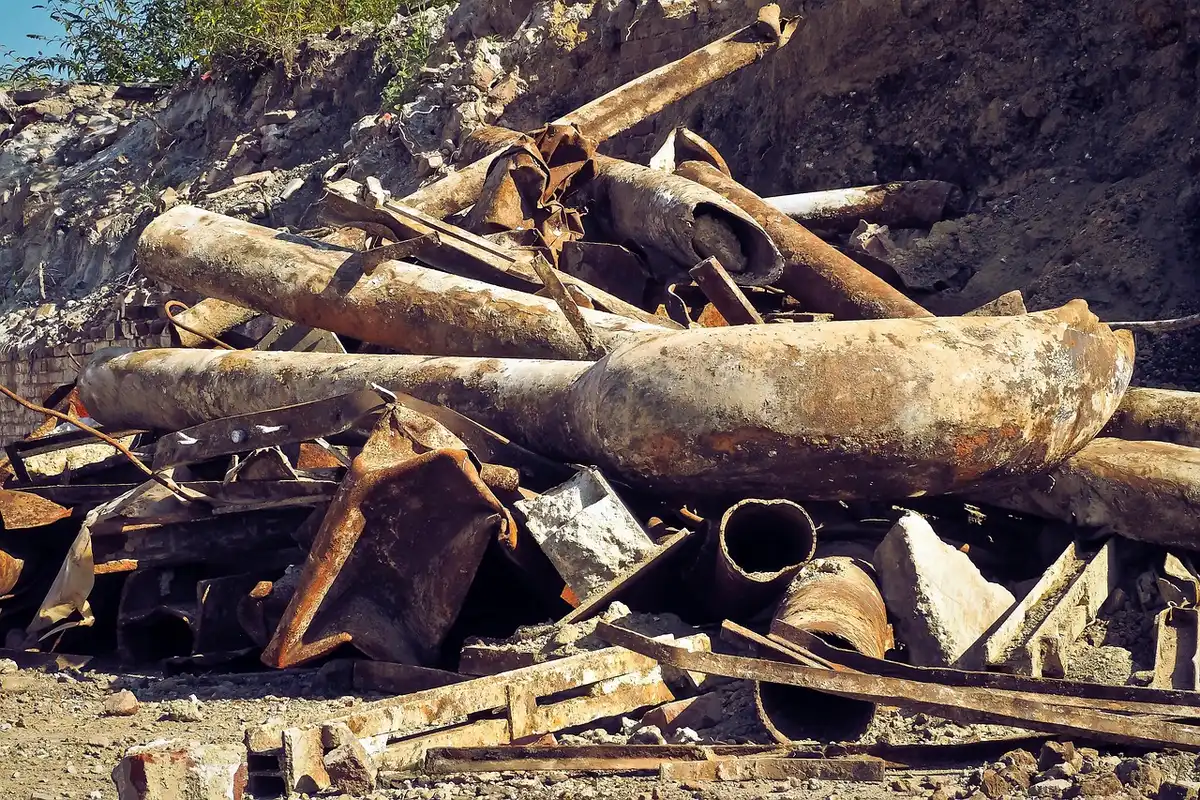 Collapsed sewer pipe discharging into a river with polluted water