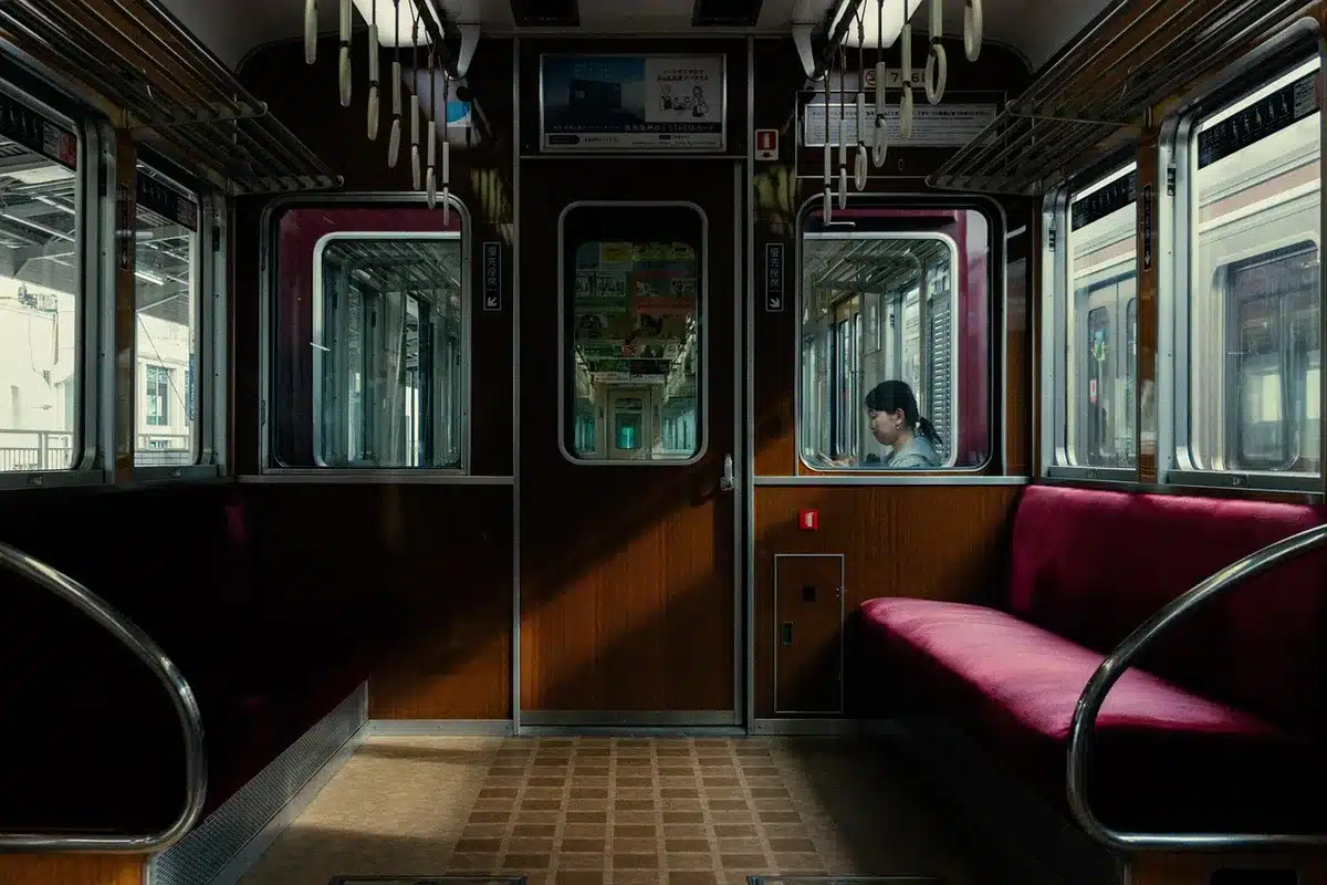 Crowded Japanese train corridor showing efficient public transit
