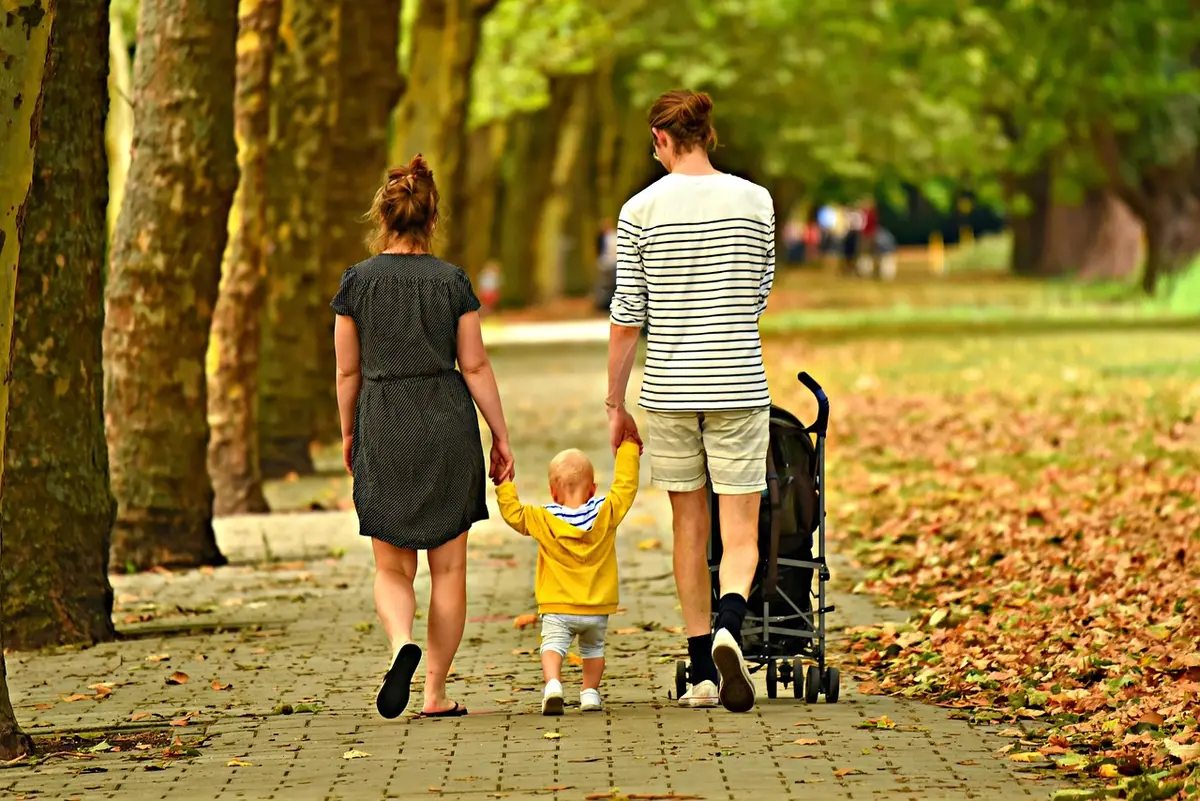 Parent reviewing child care bills and after-school program forms