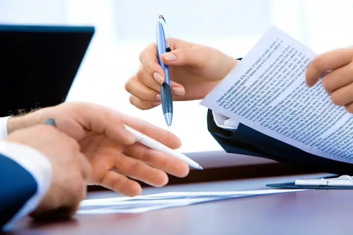 Reporter reviewing documents at a desk to check claims